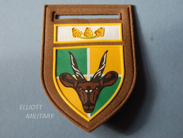 badge with gazelles head on a shield