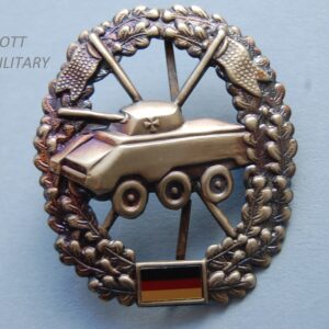 badge with tank within a wreath above the German flag
