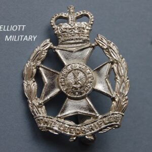 badge with Maltese cross below a crown within a wreath and scroll