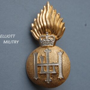 badge with a flaming bomb with lettering HLI below a crown