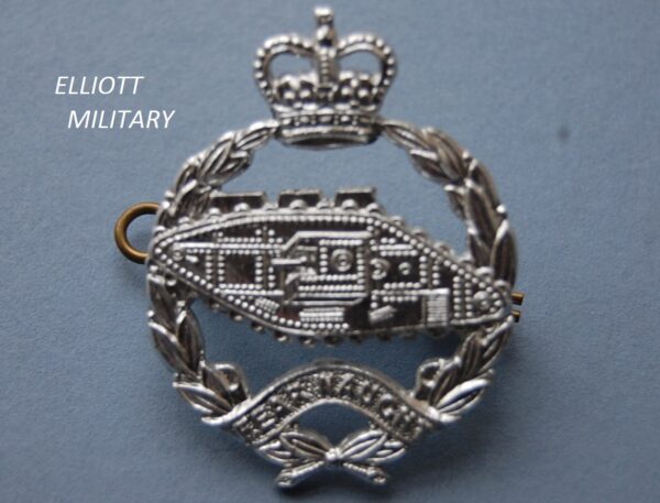 badge with WW1 tank inside wreath with crown above and scroll below reading fear naught