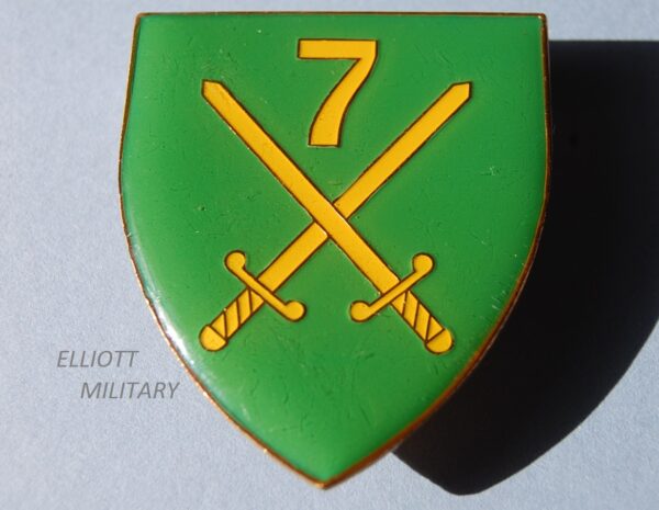 Badge with crossed swords and number 7 on shield