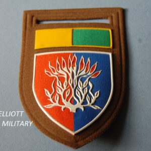 cloth badge with flaming bush on a shield