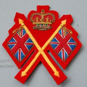 cloth badge with crossed Union Jack flags and crown