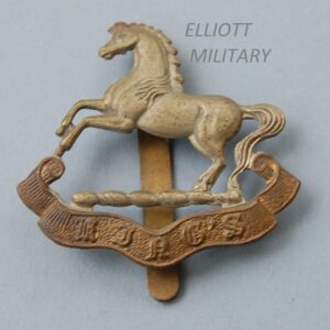 badge with horse above a scroll reading Kings