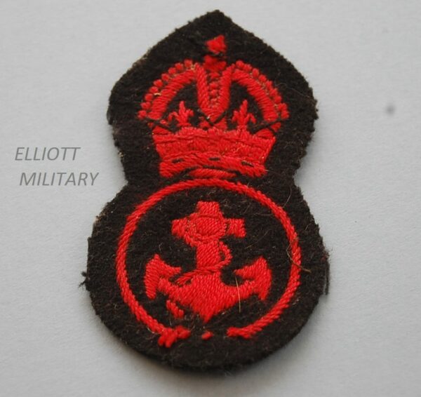 padded cloth badge with red Kings crown above an anchcrown above and anchor within a circle on black backing
