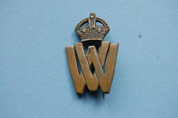 small badge with VW below a crown