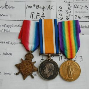 trio of medals with papers
