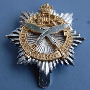 badge with crossed kukri knives on top of a star within a wreath with E11R royal cypher and crown above