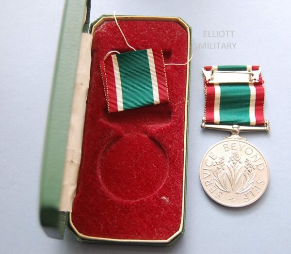 REVERSE OF MEDAL AND BOX INTERIOR
